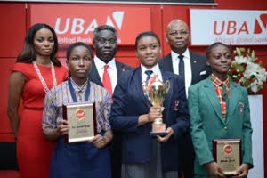 Managing Director, UBA Foundation, Ms. Ijeoma Aso, GMD/CEO, UBA Plc, Mr. Phillips Oduoza and DMD, UBA Plc, Mr. Kennedy Uzoka with the winners of 2015 UBA Foundation National Essay Competition- 1st prize winner Miss Emediong Uduak Uko of British Nigerian Academy, Abuja (middle) ;  2nd prize winner Miss Enonuoya Starish of Lagoon School Lagos (right); and 3rd prize winner Miss Eze Ugochinyere Golden of Living World Academy Aba, during the grand finale and prize giving ceremony held at UBA House in Lagos on Monday.